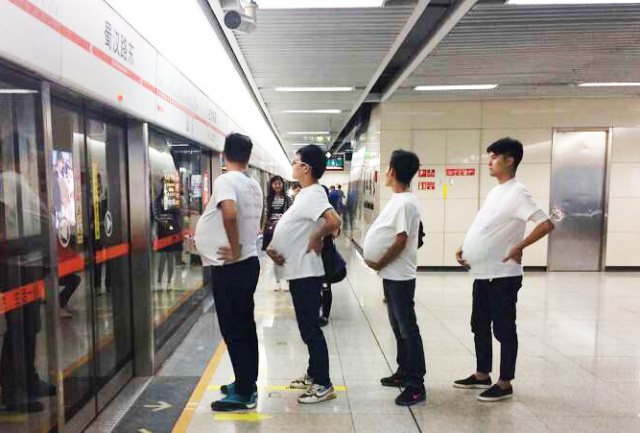 'Pregnant' men in Chengdu subway call for more freedom for pregnant women