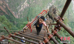 Village on cliff builds steel ladder to connect with valley 1km below 
