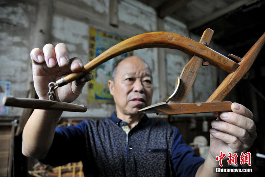 Carpenter crafts traditional farm tools in Jiangxi