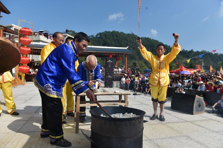 Stunt 'climbing on blades' performs in China's Fujian province