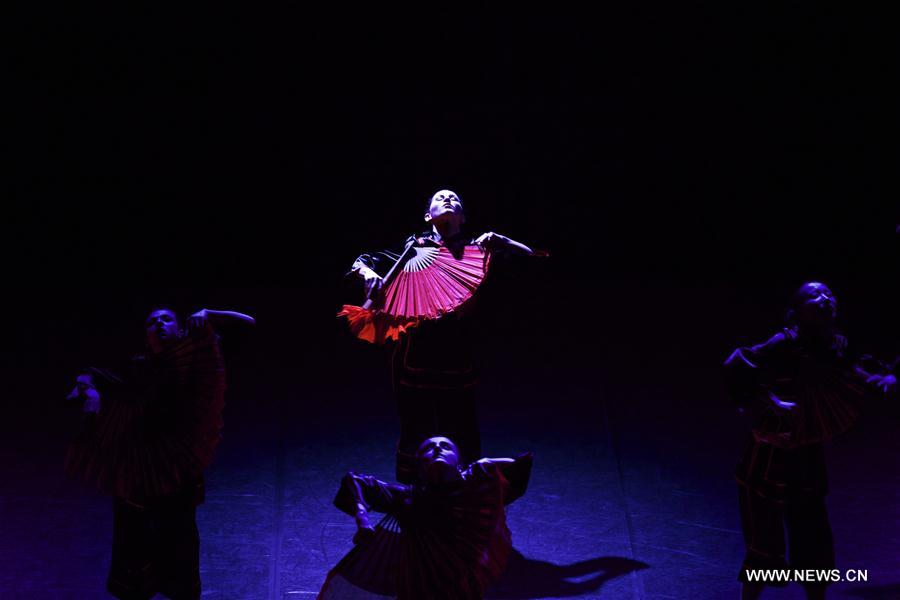 Performers dance during the dancing show 'Heaven, Earth, People' in Rome, Italy, Dec. 10, 2016. The show 'Heaven, Earth, People' is directed by Two Chinese students Zheng Lu and Jiang Churui, who graduated from Beijing Dancing Academy. 