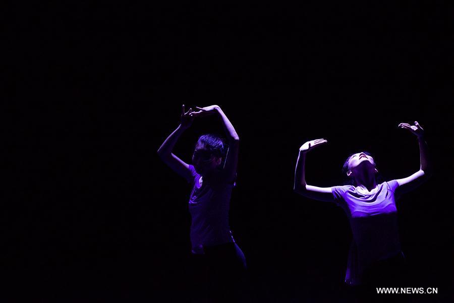 Performers dance during the dancing show 'Heaven, Earth, People' in Rome, Italy, Dec. 10, 2016. The show 'Heaven, Earth, People' is directed by Two Chinese students Zheng Lu and Jiang Churui, who graduated from Beijing Dancing Academy. 