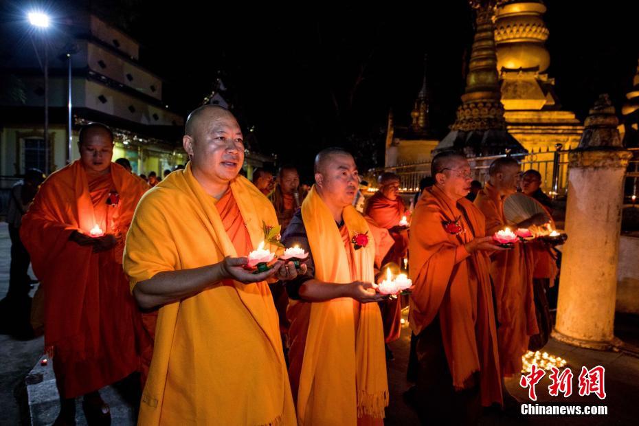 Buddhists light candles, pray for peace on border between China and Myanmar