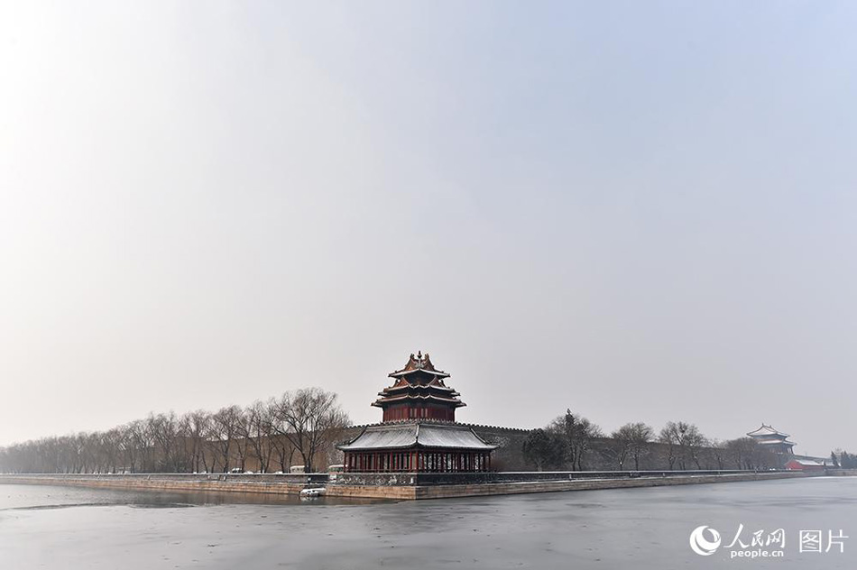 Enjoy the poetic beauty of Palace Museum coated in snow