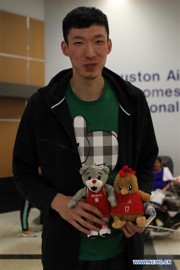 China's basketball player Zhou Qi arrives in Houston