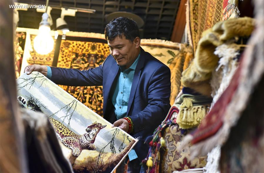 Fraidoun of Afghanistan runs carpet business in China's Xinjiang