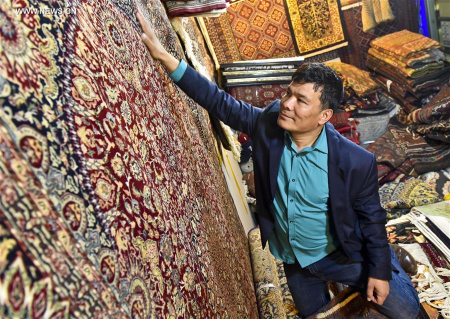 Fraidoun of Afghanistan runs carpet business in China's Xinjiang