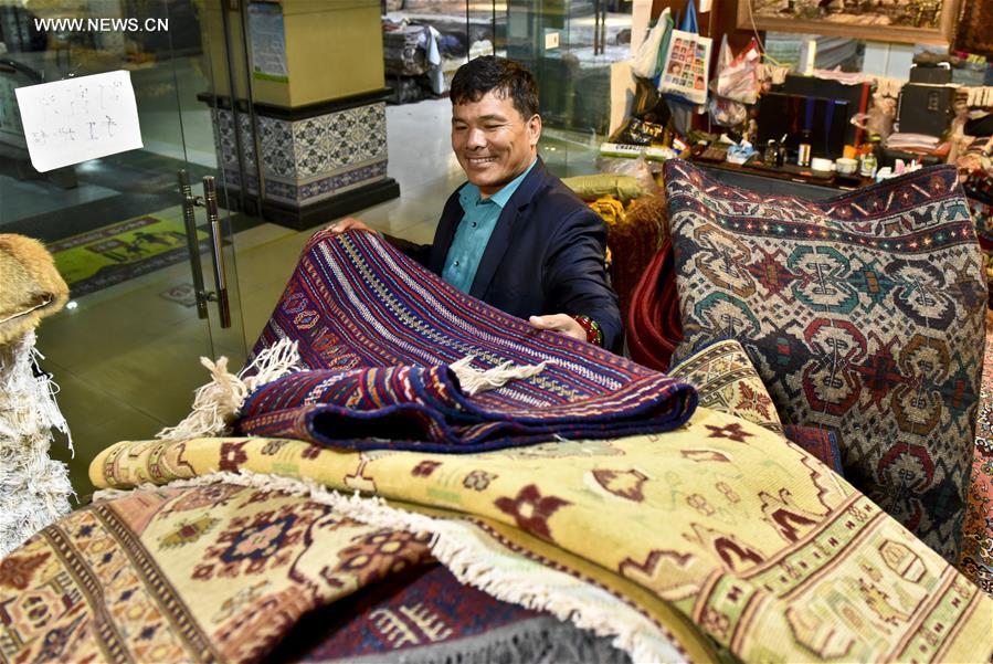 Fraidoun of Afghanistan runs carpet business in China's Xinjiang