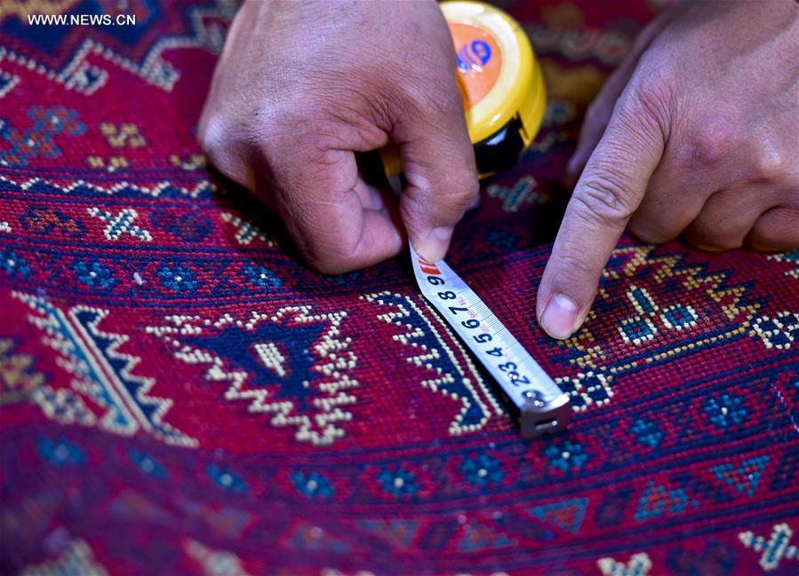 Fraidoun of Afghanistan runs carpet business in China's Xinjiang