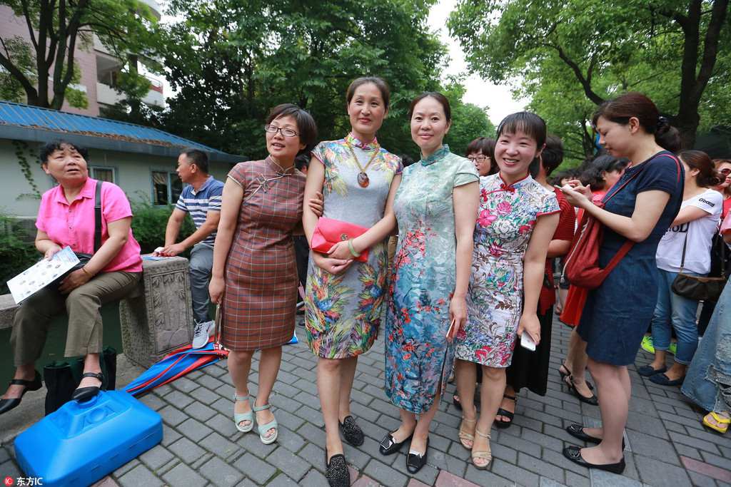 Anxious parents don lucky red clothing outside college entrance exam sites