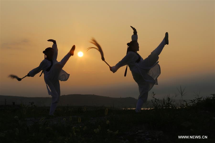 People enjoy outdoor exercises in summer day in China