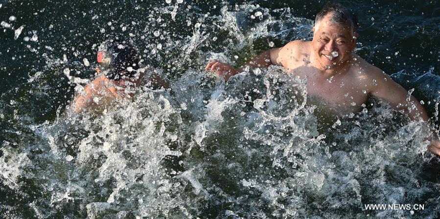 People enjoy outdoor exercises in summer day in China