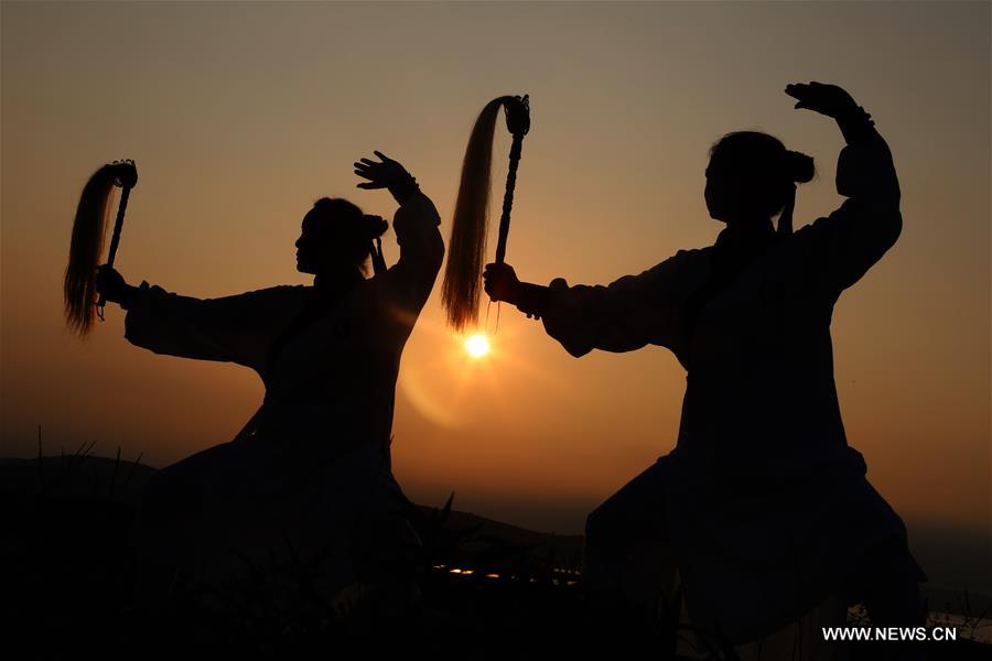 People enjoy outdoor exercises in summer day in China