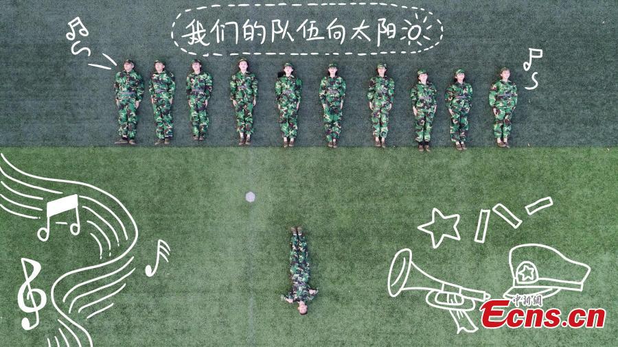 128 students mark military training with creative postures