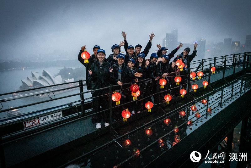 Chinese families ascend Sydney Harbour Bridge with lanterns to welcome the Lunar New Year