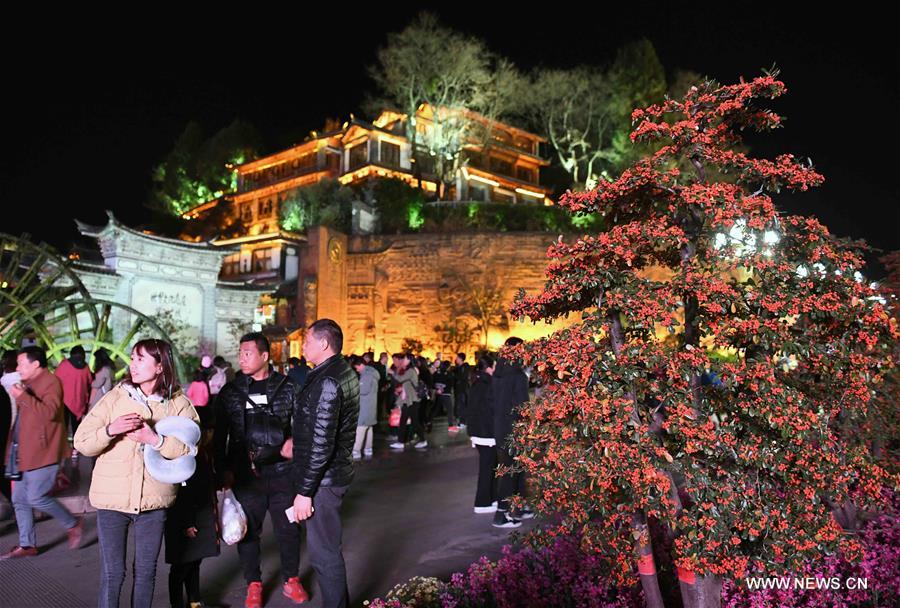 Tourists visit Lijiang ancient town in southwest China's Yunnan