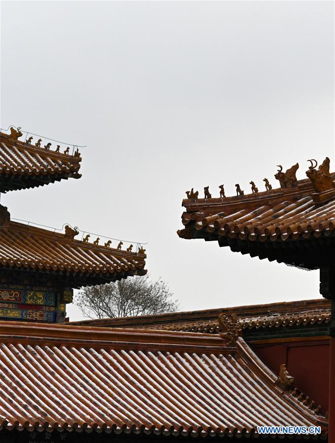 Visitors view snowy scenery at Palace Museum in Beijing