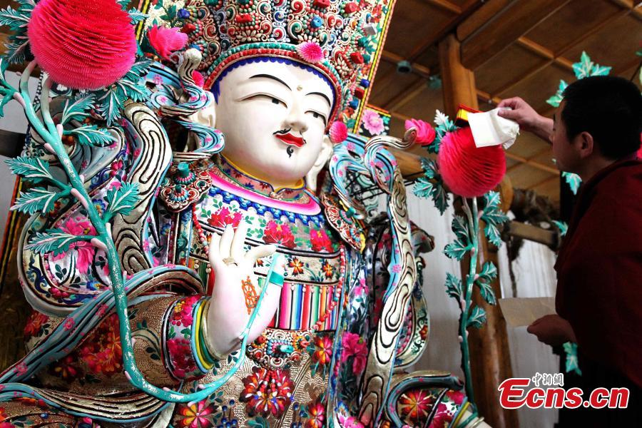 Butter sculptures of Buddha figurines exhibited at Ta'er Monastery