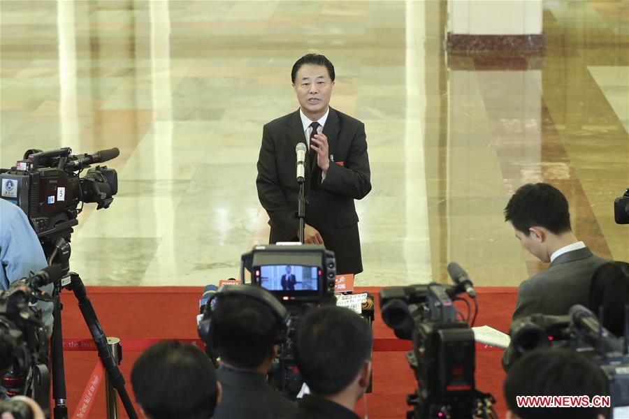 Ministers receive interview after 3rd plenary meeting of 2nd session of 13th NPC