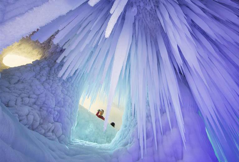 Tourists visit ice cave in Luyashan scenic area, north China's Shanxi