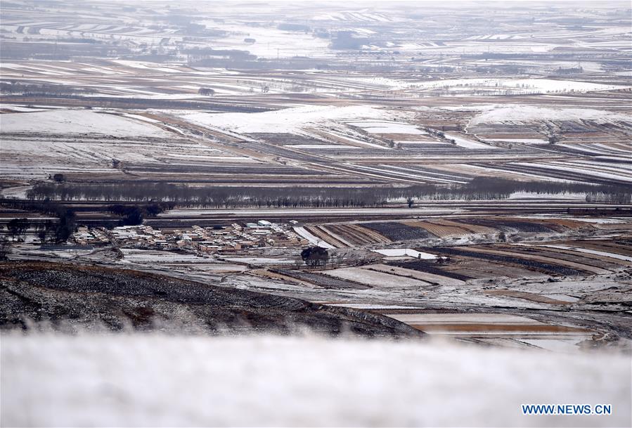 Scenery of snow-covered village houses and fields in China's Inner Mongolia