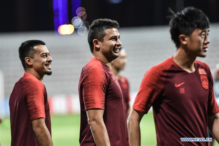 Players of China and Syria attend training sessions before group A match