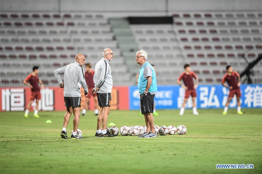 Players of China and Syria attend training sessions before group A match