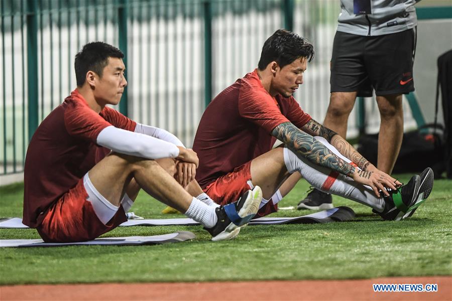 Players of China and Syria attend training sessions before group A match