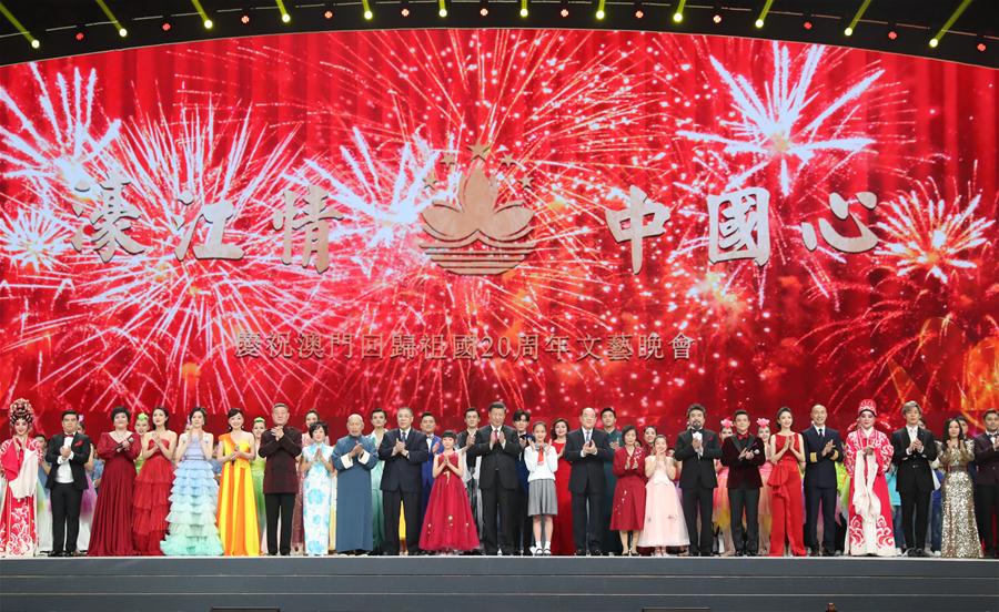 Chinese President Xi Jinping, also general secretary of the Communist Party of China Central Committee and chairman of the Central Military Commission, joins main cast members in singing a patriotic song to deliver wishes for the motherland''s prosperity and Macao''s brighter future while attending a grand gala in celebration of the 20th anniversary of Macao''s return to the motherland, in south China''s Macao, Dec. 19, 2019. (Xinhua/Huang Jingwen)