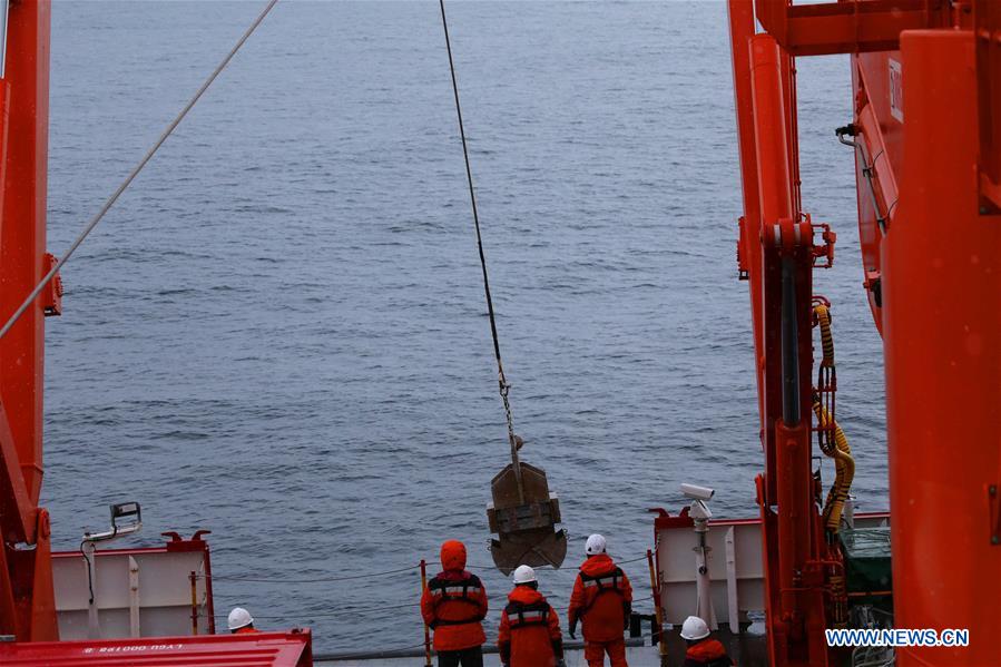 China's 36th Antarctic expedition team work on icebreaker Xuelong 2