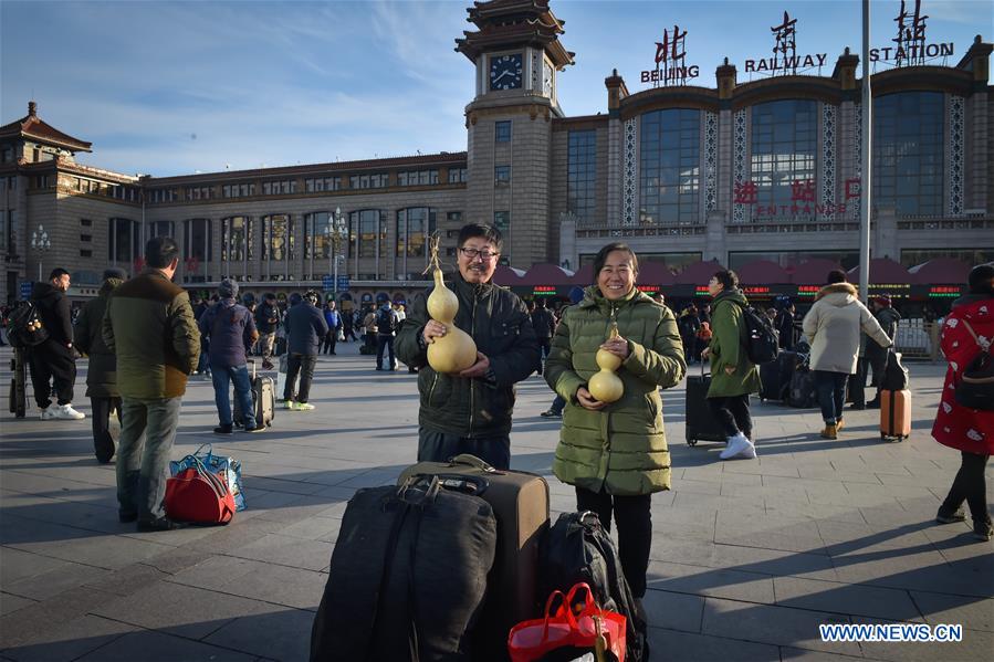 Passengers bring gifts for families as they head home for Spring Festival