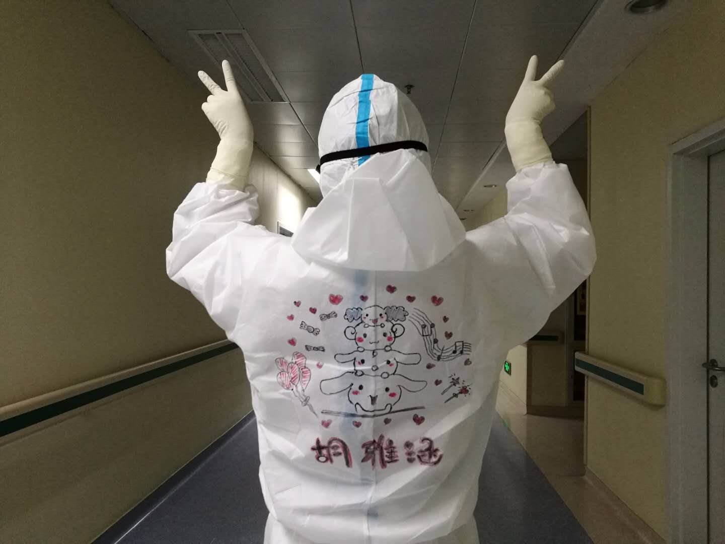 Post-90s frontline nurse draws on colleagues’ protective suits to boost morale