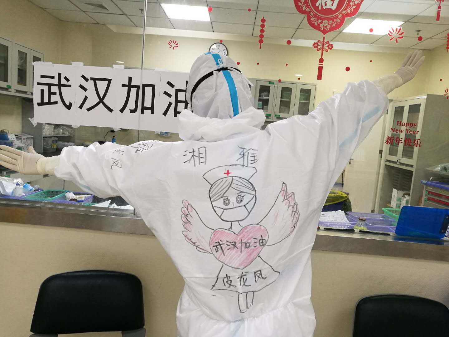 Post-90s frontline nurse draws on colleagues’ protective suits to boost morale