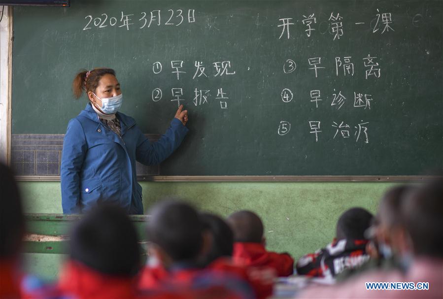 China's Xinjiang reopens all primary, high schools as outbreak wanes