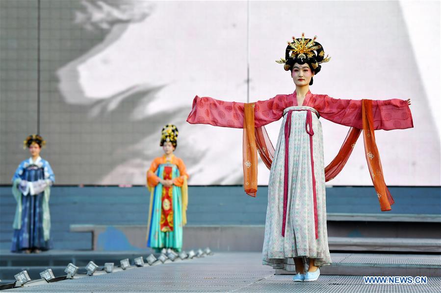 People dressed in costumes of Tang Dynasty present performance in Xi'an