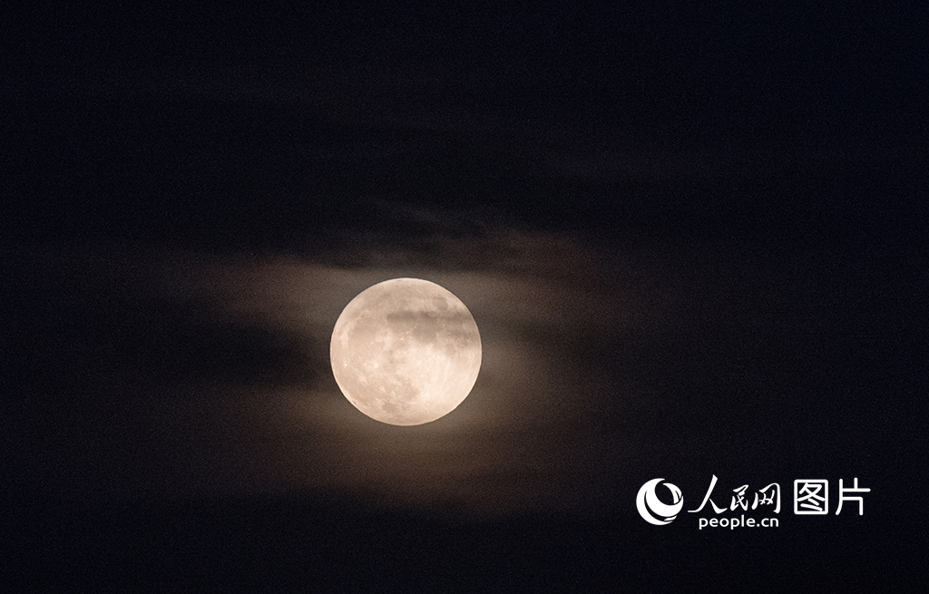 In pics: Rare phenomenon of early full moon seen across China