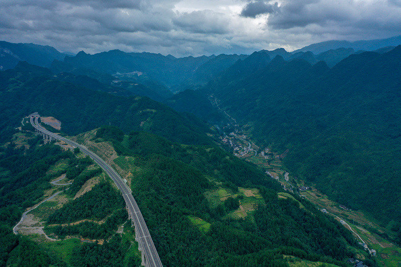 Winding mountain paths in central China's Hubei emerge as broad roads