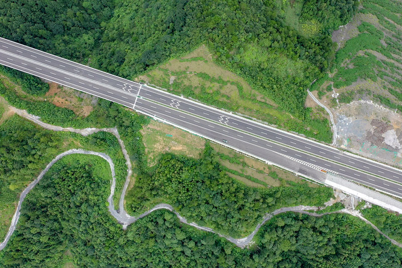 Winding mountain paths in central China's Hubei emerge as broad roads