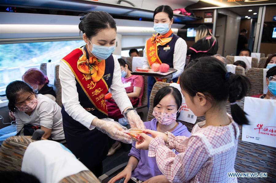 National Day, Mid-Autumn Festival celebrated on Fuxing bullet train