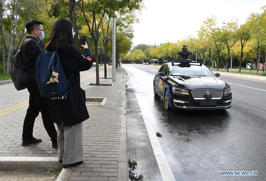 Baidu launches program in Beijing to offer free trials of its self-driving taxi service