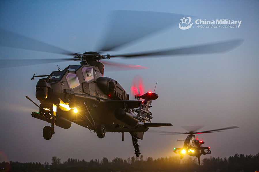 Multi-type attack helicopters hover at low altitude