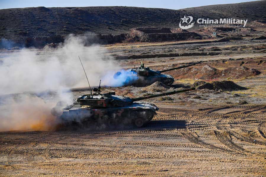 Tanks fire towards simulated enemies