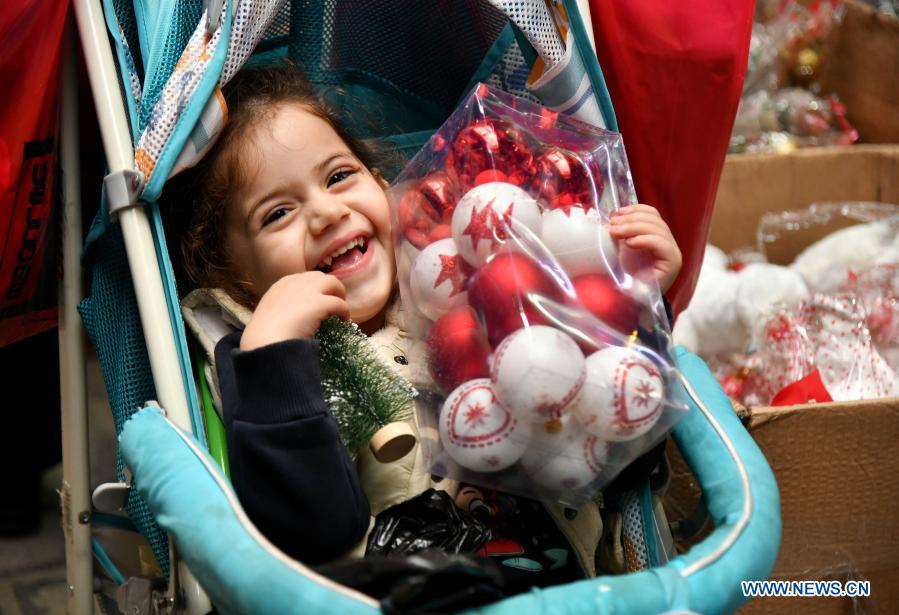 Children with Christmas decorations in Syria