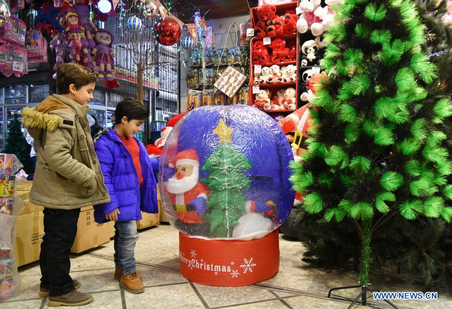Children with Christmas decorations in Syria