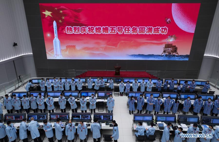 Technical personnel work at Beijing Aerospace Control Center in Beijing, capital of China, Dec. 17, 2020. The return capsule of China's Chang'e-5 probe touched down on Earth in the early hours of Thursday, bringing back the country's first samples collected from the moon, as well as the world's freshest lunar samples in over 40 years. (Xinhua/Jin Liwang)