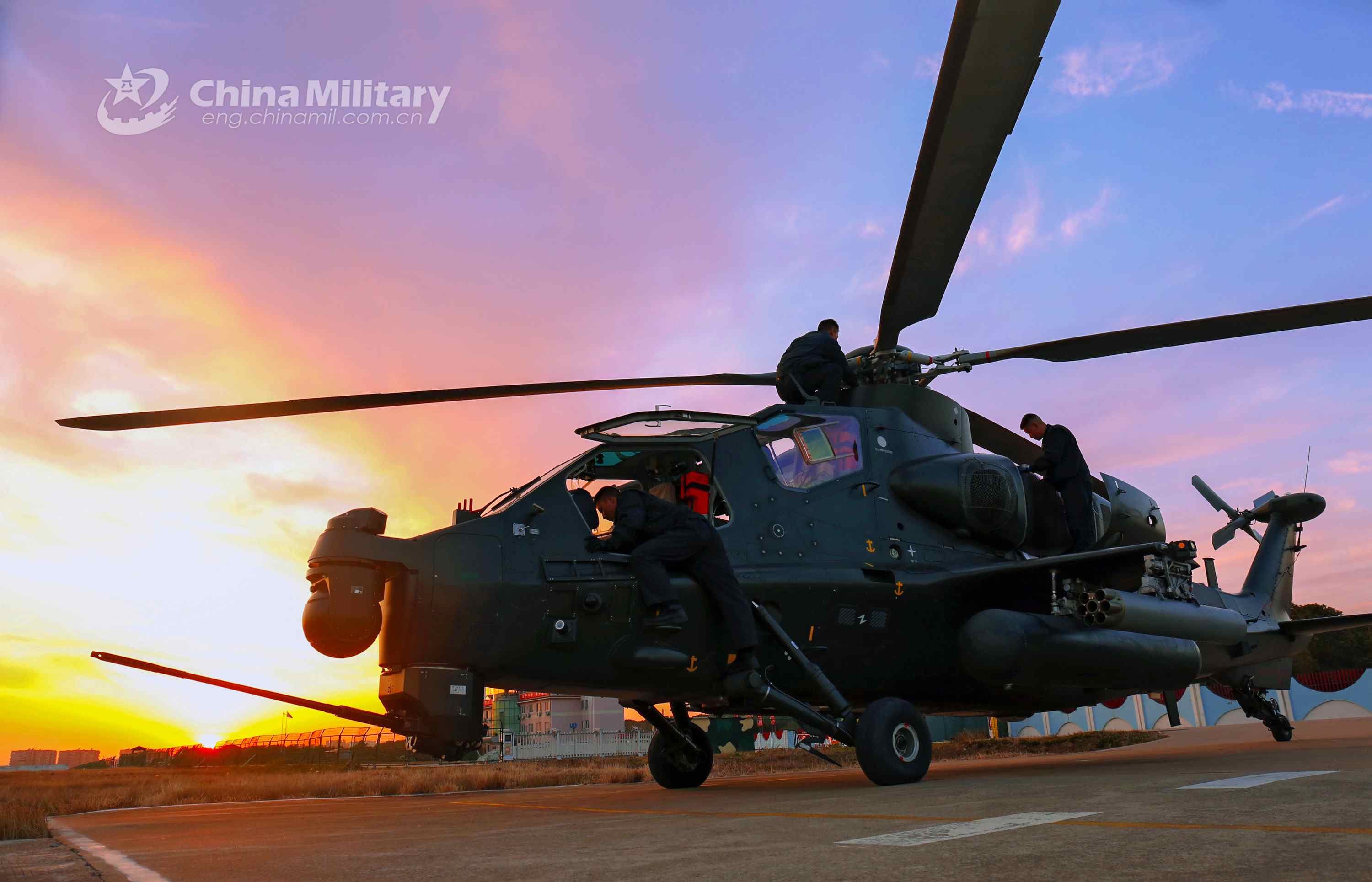 Maintenance men perform inspections before flight mission