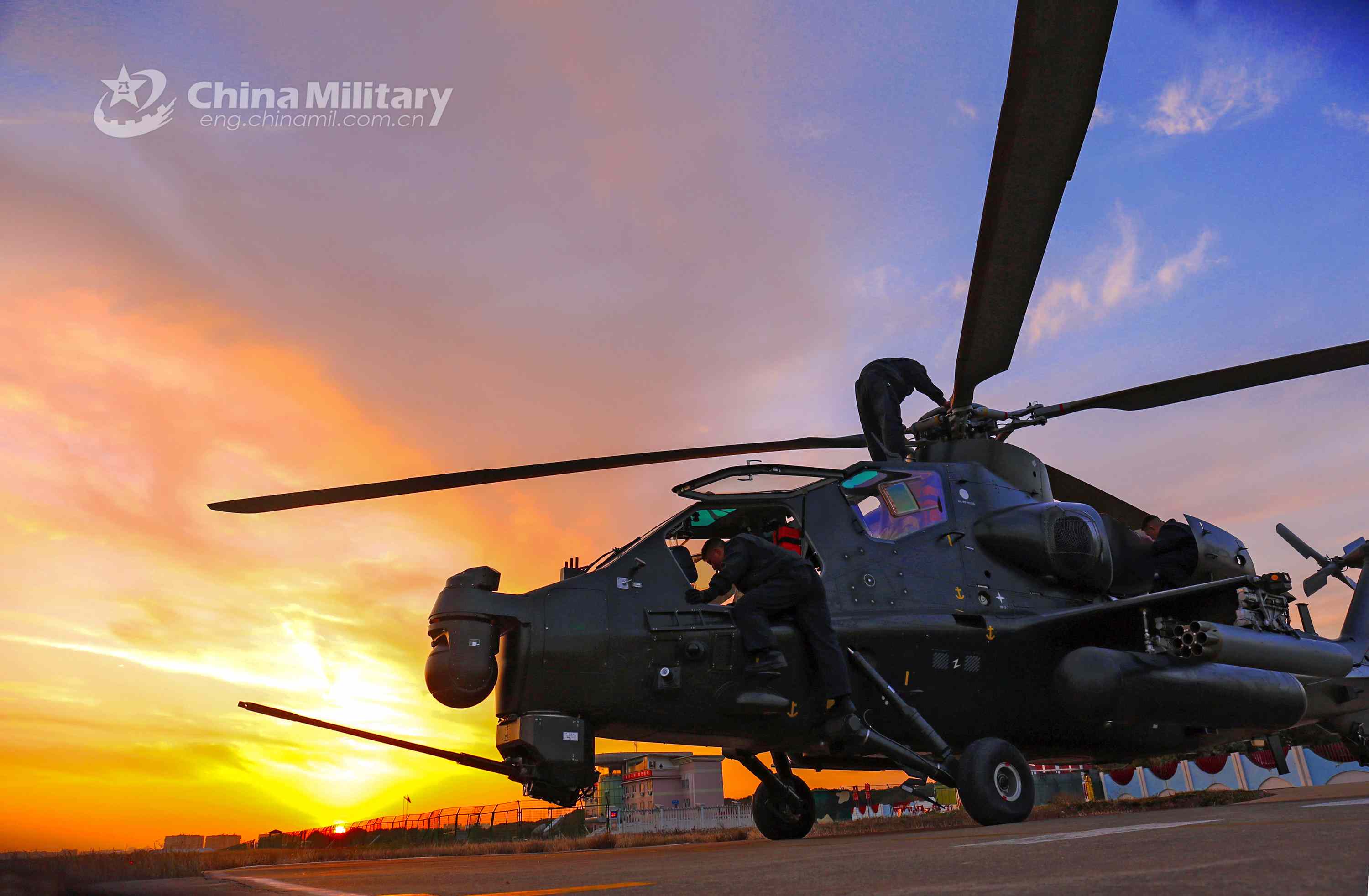 Maintenance men perform inspections before flight mission