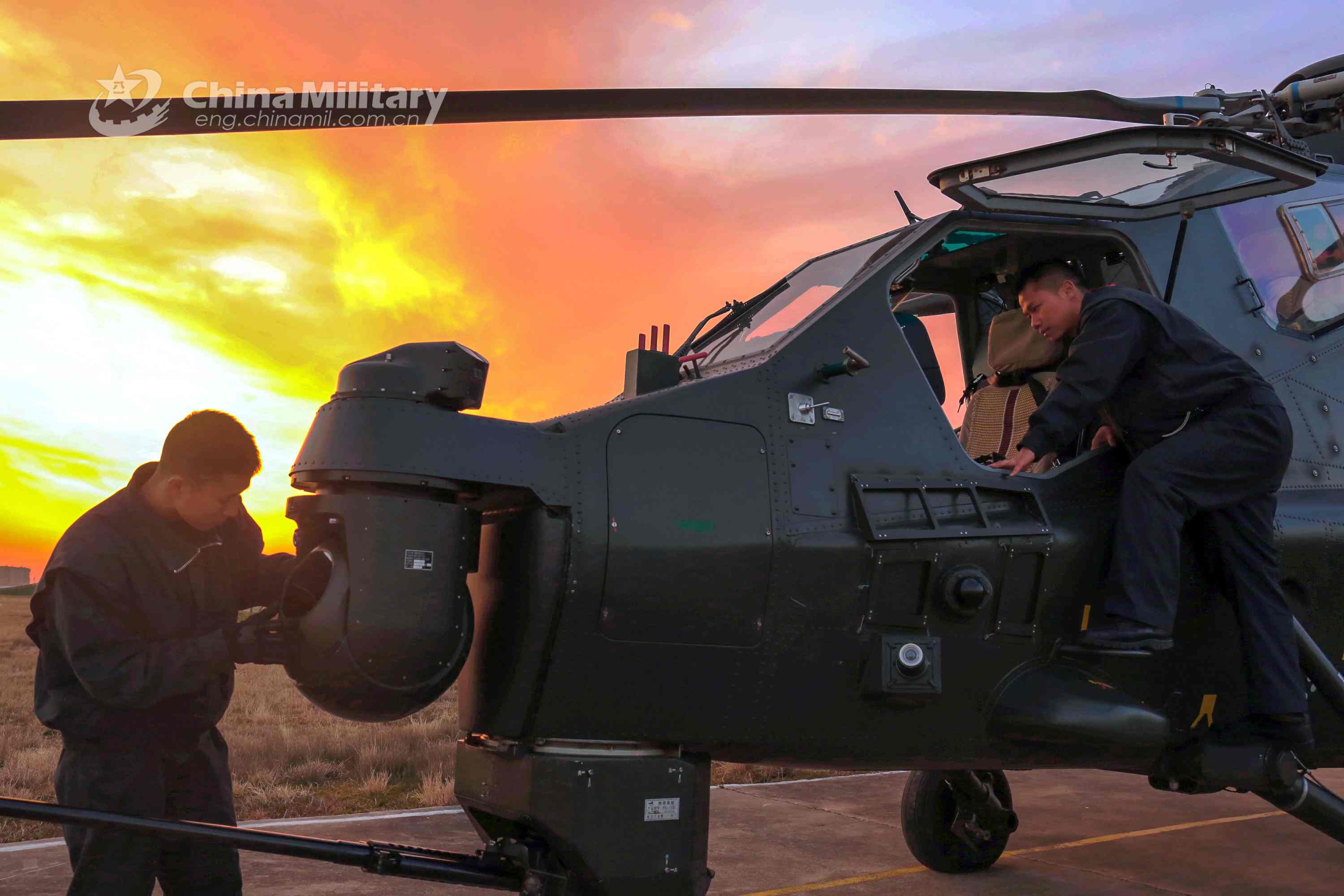 Maintenance men perform inspections before flight mission