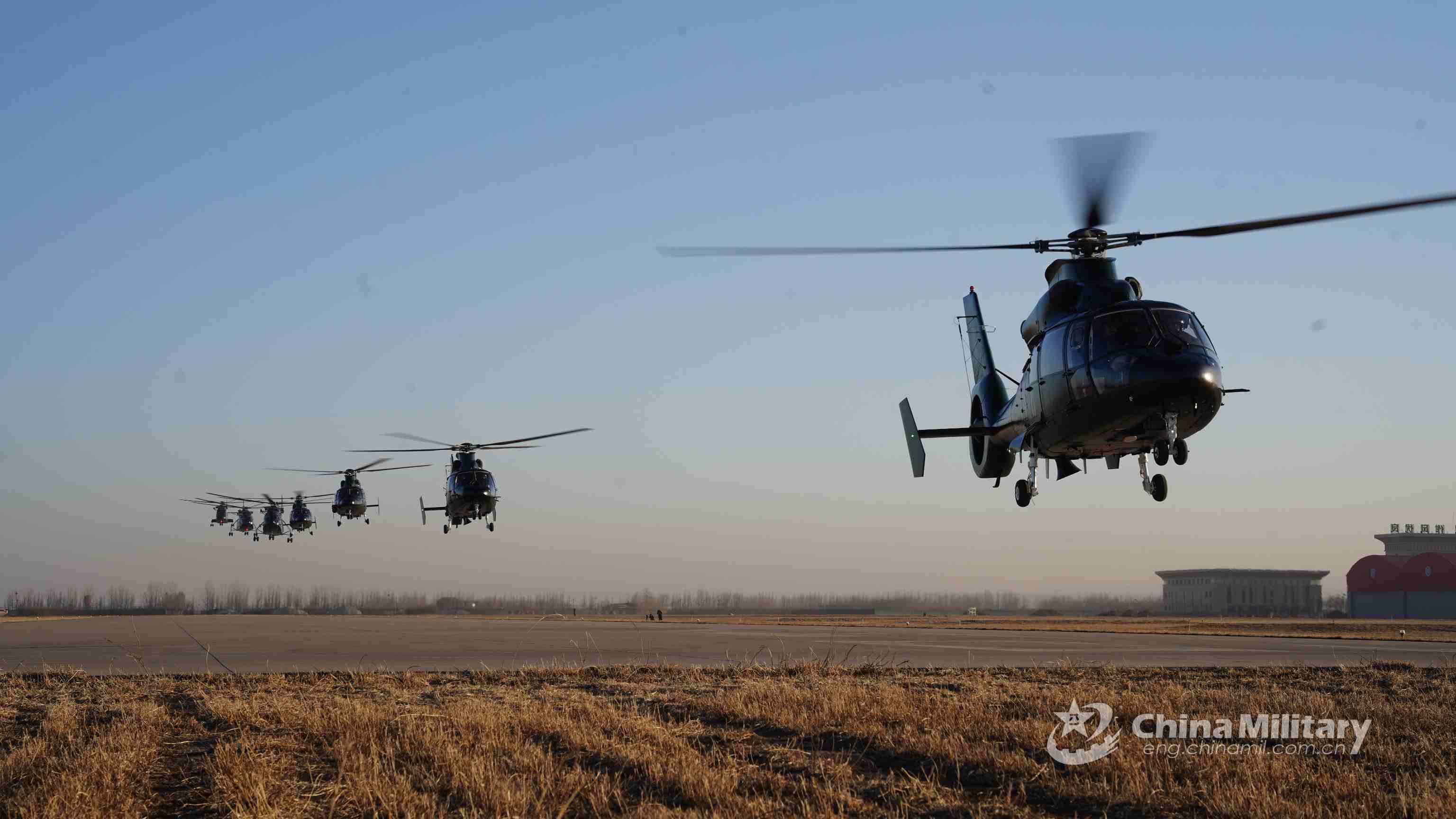 PAP service members manipulate attack helicopters in flight mission