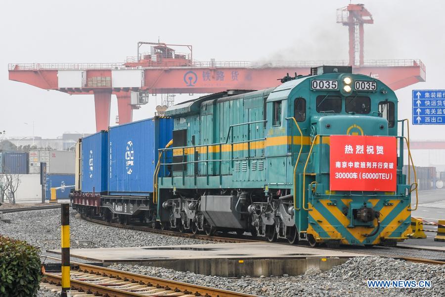 A China-Europe cargo train loaded with containers of electronic products and accessories of household appliances leaves for Russia’s Vorsino in Nanjing, east China’s Jiangsu Province, Jan. 27, 2021. A total of 60,000 twenty-foot equivalent unit (TEU) containers have been shipped from Nanjing to Europe since its maiden journey in 2016. (Xinhua/Li Bo)